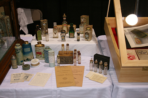 California Perfume Company Display at FOBHC Expo: Tins, Bottles, and Paper