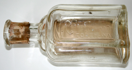 Rear, embossed panel of the California Tooth Wash Bottle - 1908